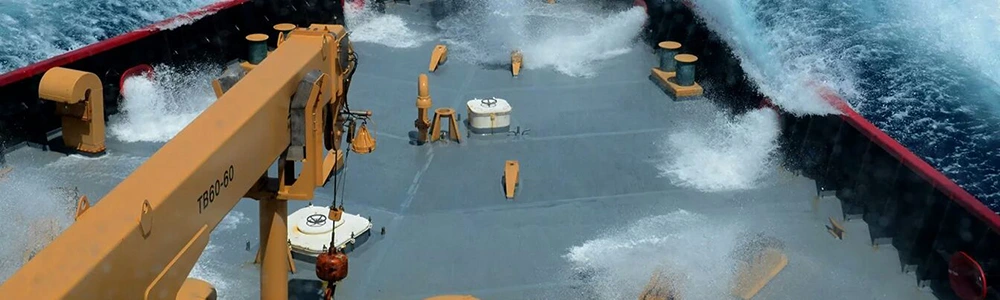 Ship deck with telescopic boom crane