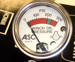One gauge tells the internal operating condition of the winch, making service simple.