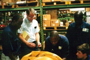 Allied Winch Engineer Ken Bush with Menutention Africaine Service Techs