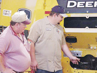 Inspecting the WH6G mounting for the 755C track loader.