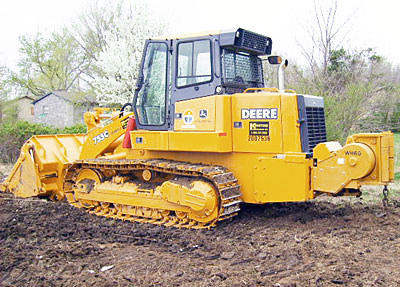 John Deere 755C track loader with WH6G mounted on its back.
