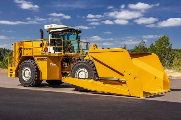 Yellow Wagner Chipdozer parked on pavement