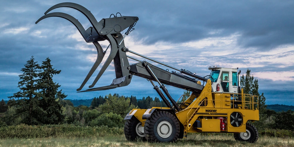 L90 Logstacker in a field